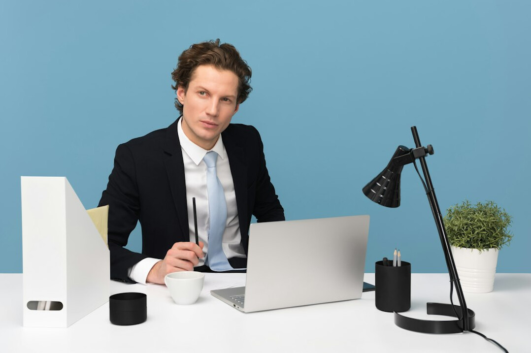 insurance programmer at desk